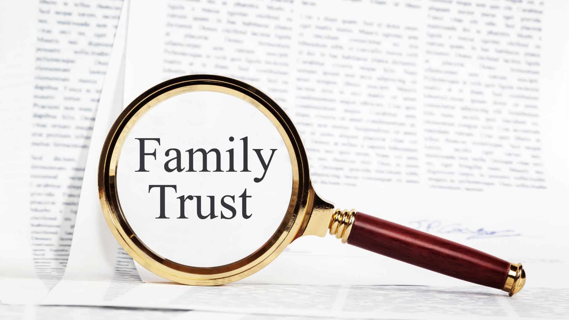 magnifying glass over text that says "Family Trust"