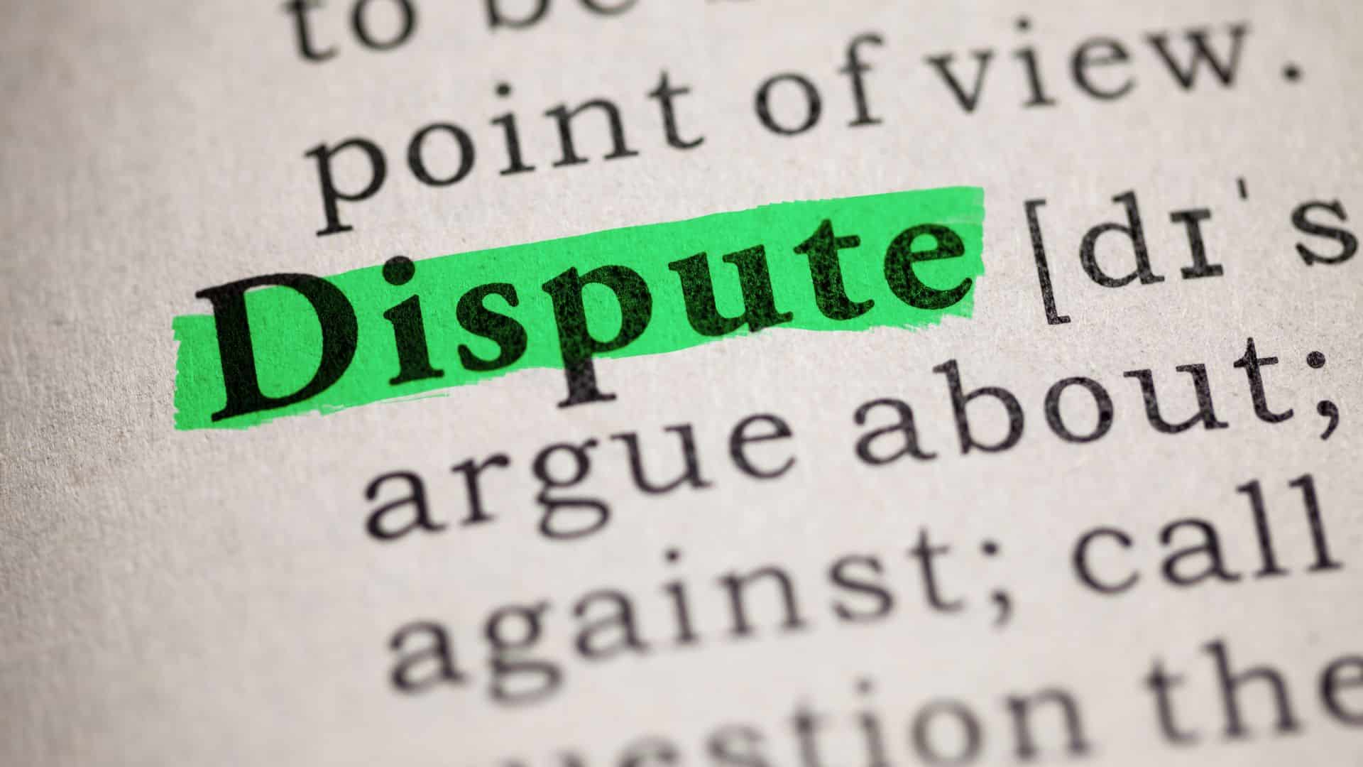 Close up of the dictionary page on which "Dispute" is highlighted